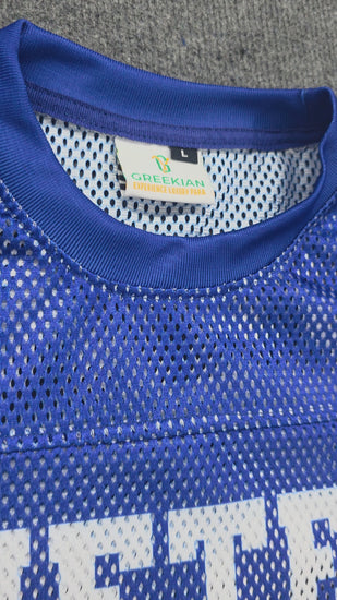 Blue mesh football-style shirt with Nineteen and number 20 printed in white
