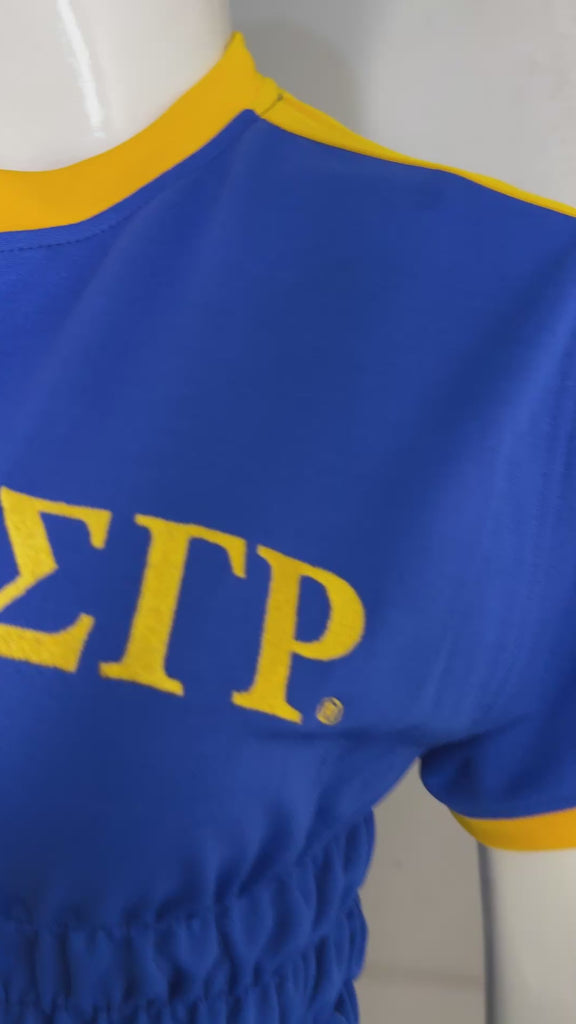 Close-up of royal blue Zeta Phi Beta crop top on mannequin with textured fabric design